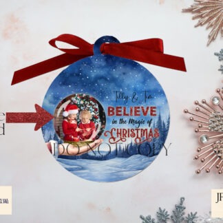 Personalised Christmas design showing Santa holding a snow globe with space for a child’s photo and name