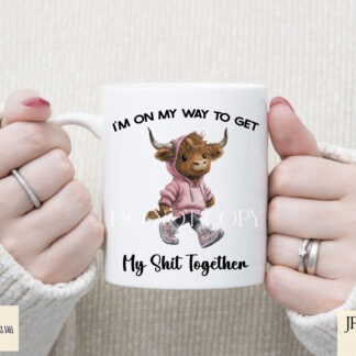 Humorous Highland cow designs in pink and orange hoodies shown on product mock ups